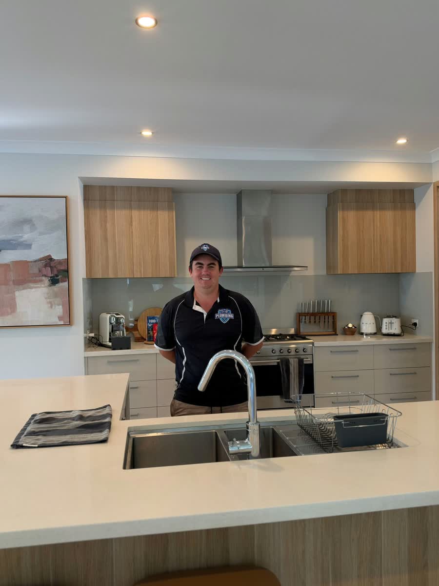 Tip Top Plumbing plumber in a kitchen