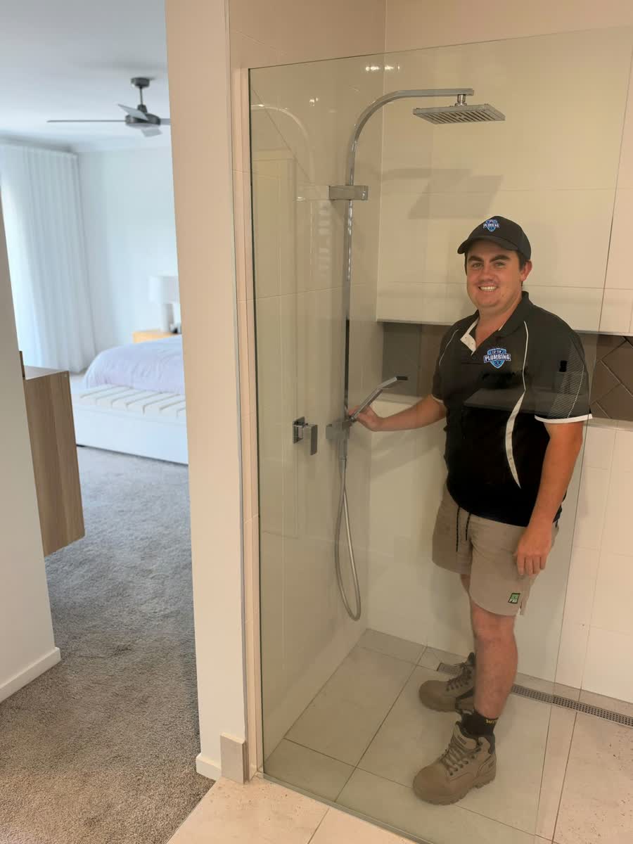 Tip Top Plumbing plumber at a shower