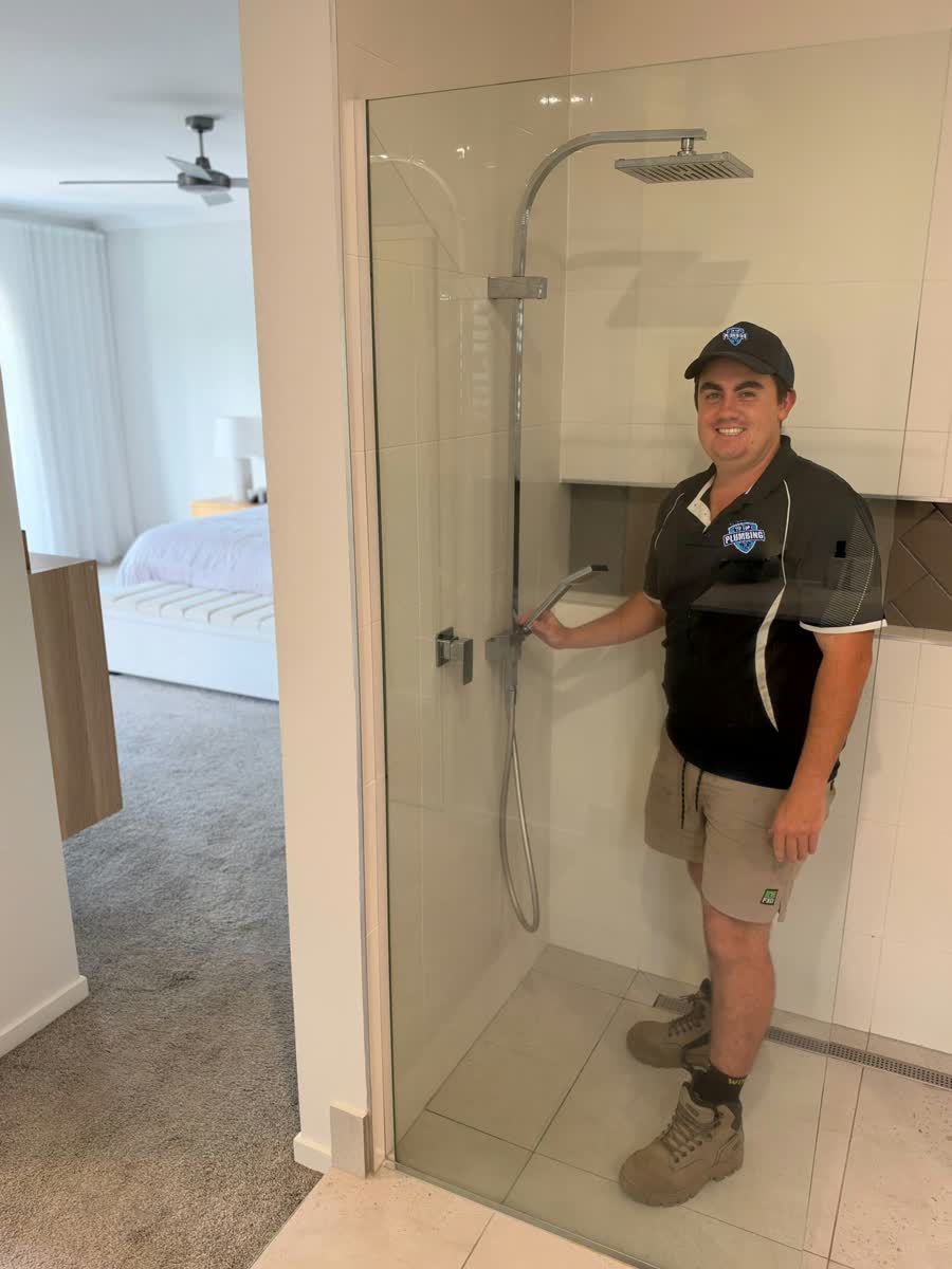 Tip Top Plumbing plumber at a shower