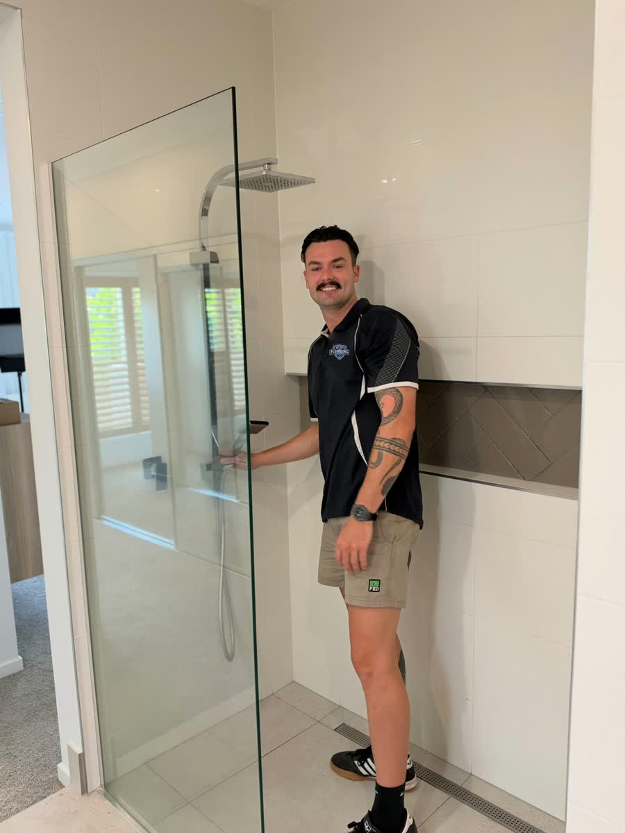 Tip Top Plumbing plumber at a shower