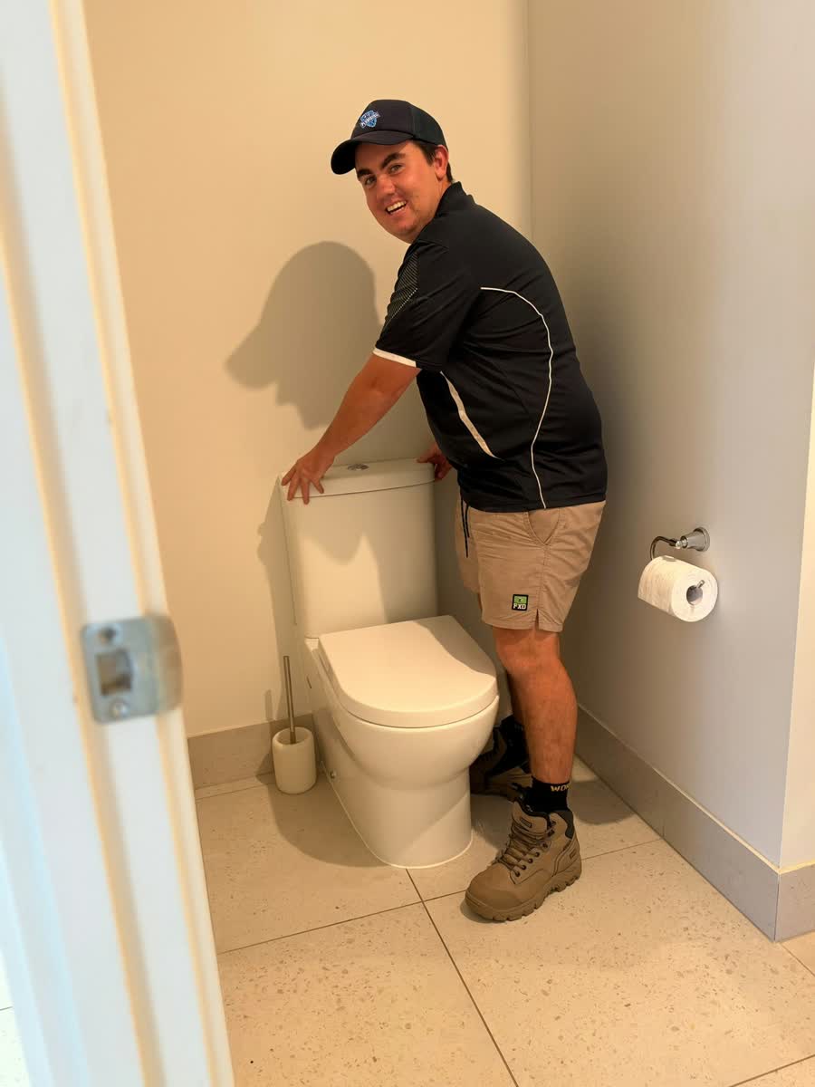 Tip Top Plumbing plumber at a toilet